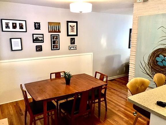 gleaming hardwood floors throughout. extra seating at bar.