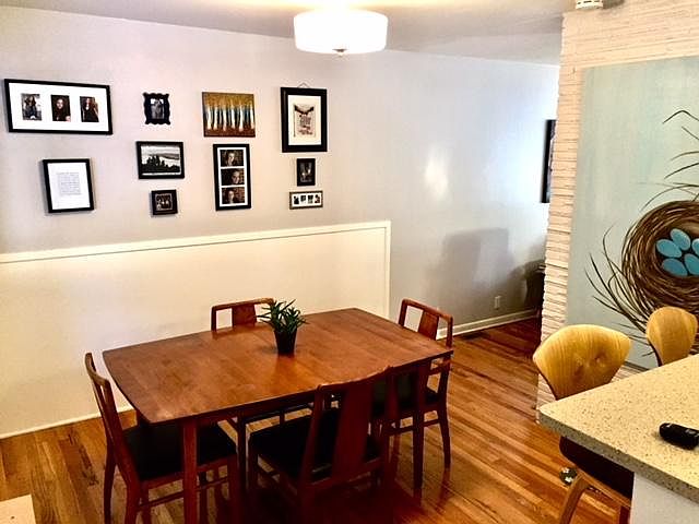 gleaming hardwood floors throughout. extra seating at bar.