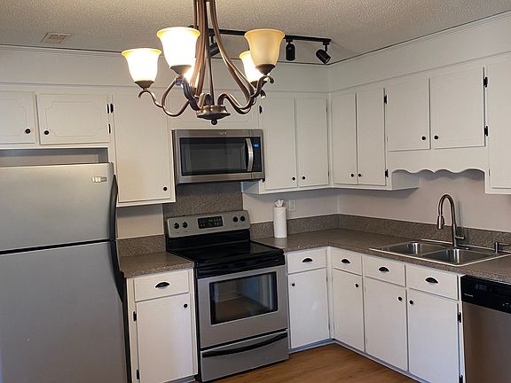 Kitchen with refrigerator and ice maker, self-cleaning oven, microwave and dishwasher