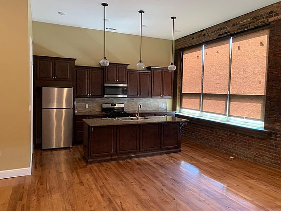 Standing in living area looking at Kitchen.