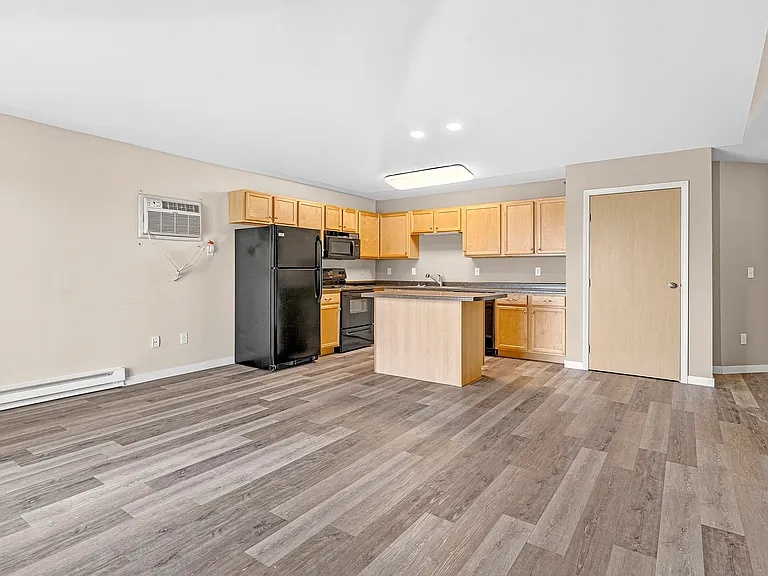 Elevate your living at Minot Place Apartments, where modern design meets functionality. This spacious kitchen features updated appliances and stylish finishes, perfect for culinary enthusiasts. Schedule your tour today to see your future home!