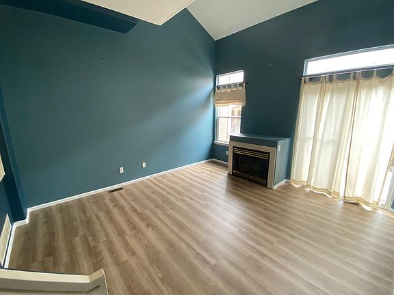 Living Room. Vaulted Ceilings, Gas Fireplace, Sliders to patio deck.