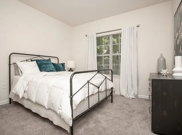 Bright, serene bedroom with cozy finishes