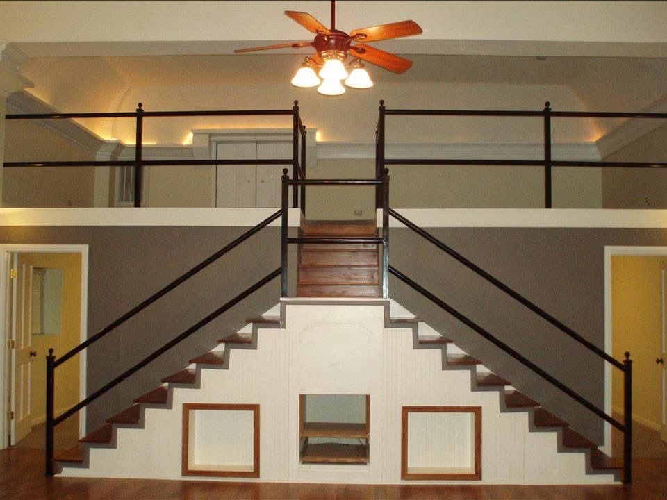 Cool duo staircase leading up to the loft, entrance to each bedroom at base of stairs