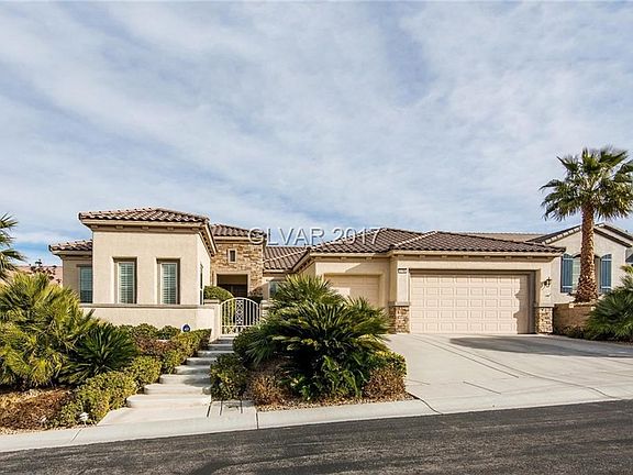 Courtyard entry, stone accents, and a spacious 3-car garage!