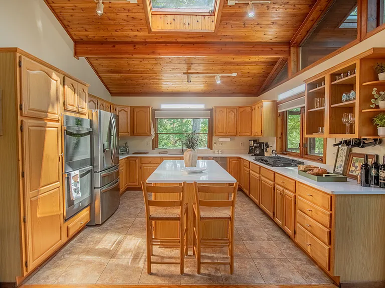 Renovated gourmet kitchen with new quartz countertops and new appliances.