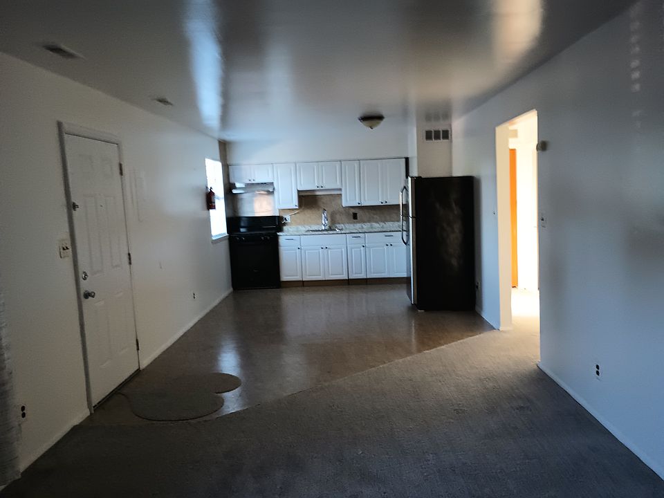 Long view of the kitchen from the perspective of the living room