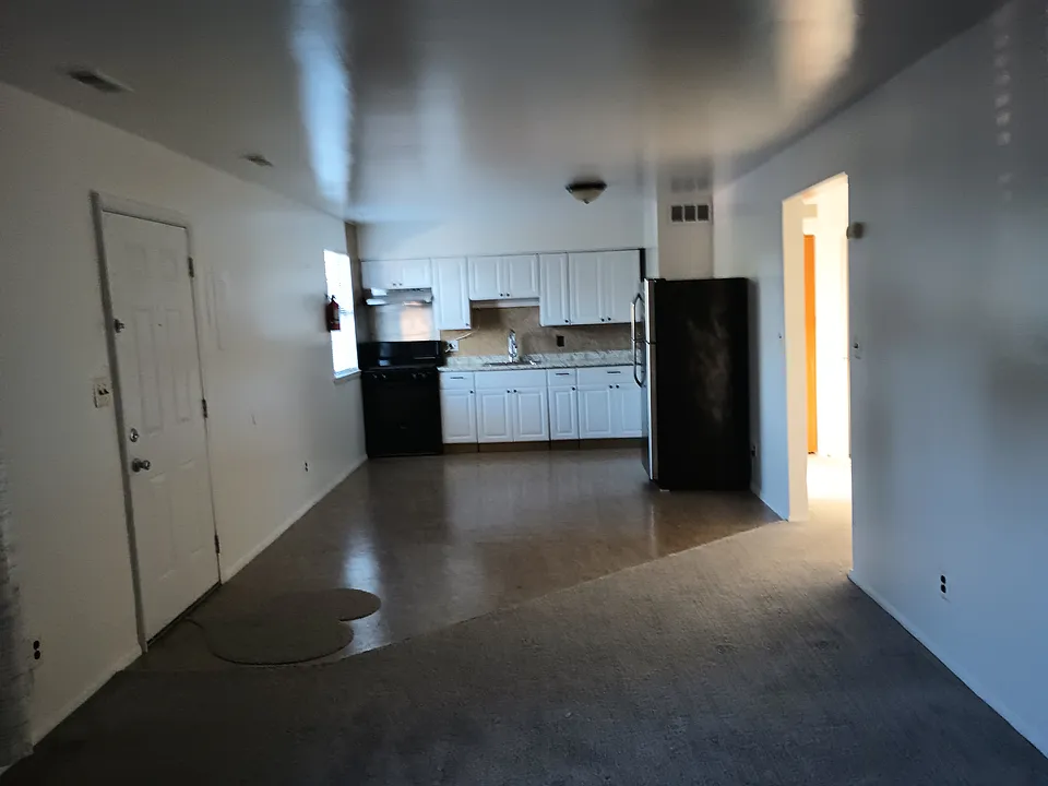 Long view of the kitchen from the perspective of the living room