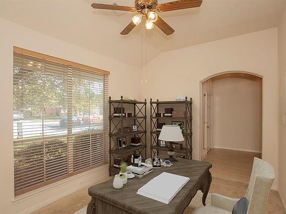 A room off the entrance offers flexible space to become your home office, play room, formal living room or whatever suits your needs. Photo is virtually staged...