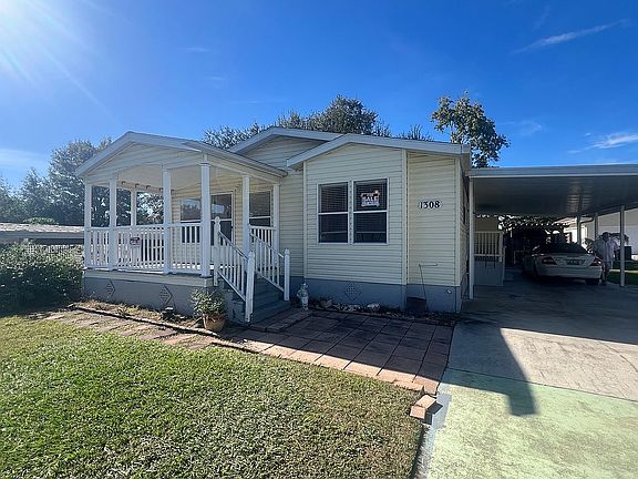 FRONT VIEW W/CARPORT