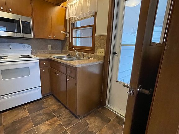 Double Sink, Door to Carport, (Two Steps Down)