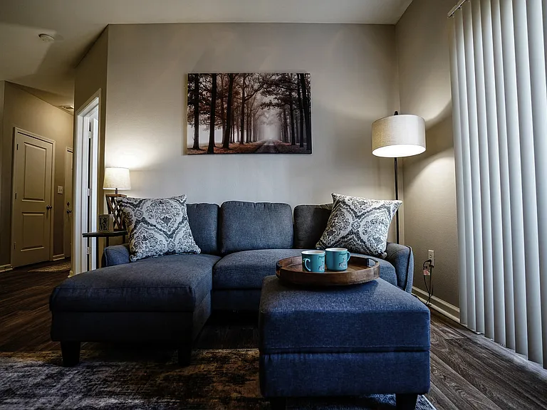 Relax in your living room that opens through a sliding glas door to your own private patio or balcony, seamlessly blending indoor and outdoor living.