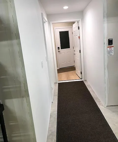 Garage walkway to the apartment stairs.