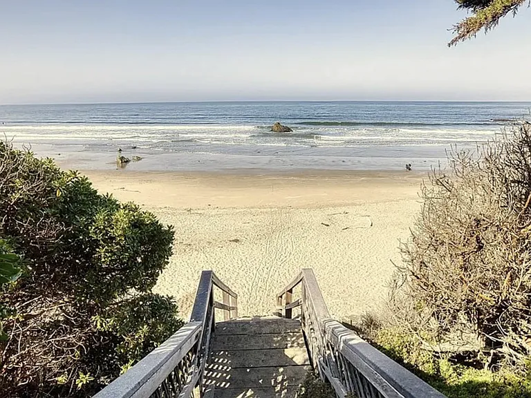 A private staircase leads directly from the patio to the sandy beach below_perfect for morning and evening strolls.