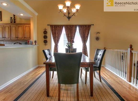 Wood floors flow through out dining and kitchen areas