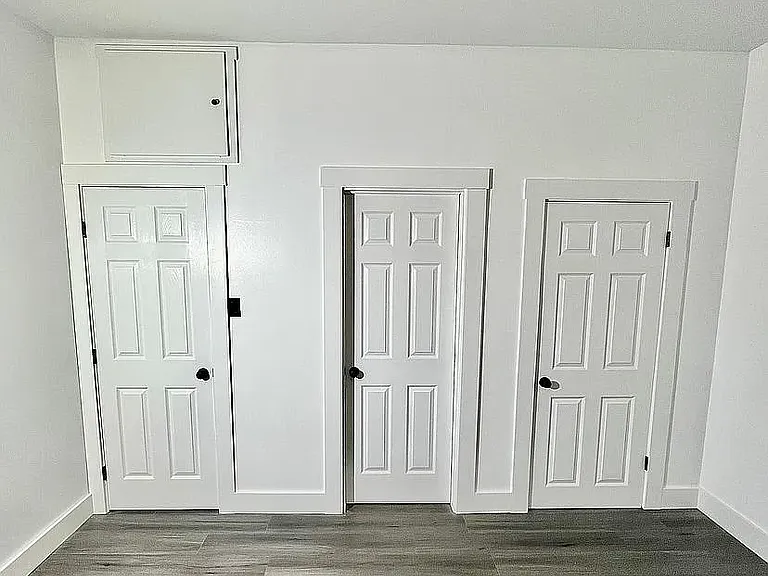 Bedroom closet, door to bathroom and door to office nook.