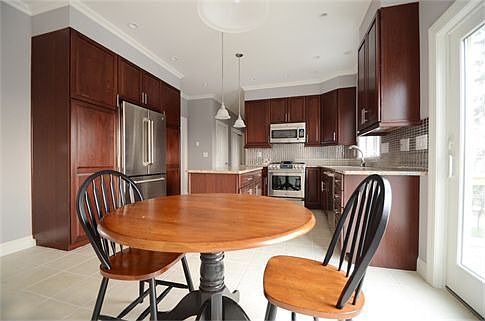 Spacious Center Island Kitchen: Granite and Stainless Appliances