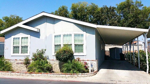 Beautiful Manufactured Home with your own carport. You can fit 2-3 cars, depending on size