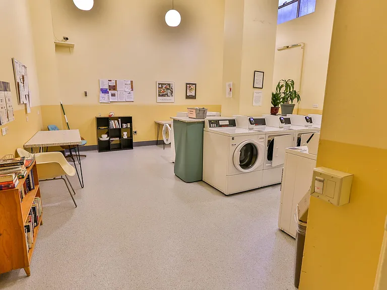 Credit card operated laundry machines in the basement.