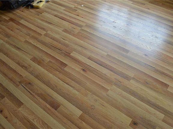 NEW FLOORING THRUOUT THE HOME, NO CARPET, TILE IN THE BATHS