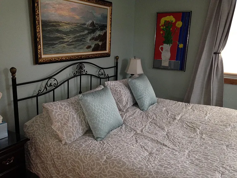 Master bedroom with king sized bed, with memory foam mattress topper.