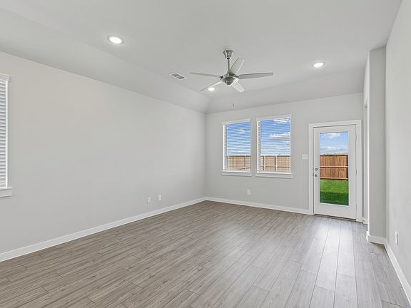 Living room in the Elm home plan by Trophy Signature Homes - REPRESENTATIVE PHOTO