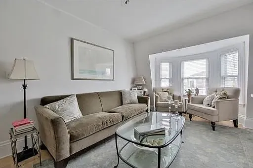 Living room, prior tenancy - 585 E 8th St #3