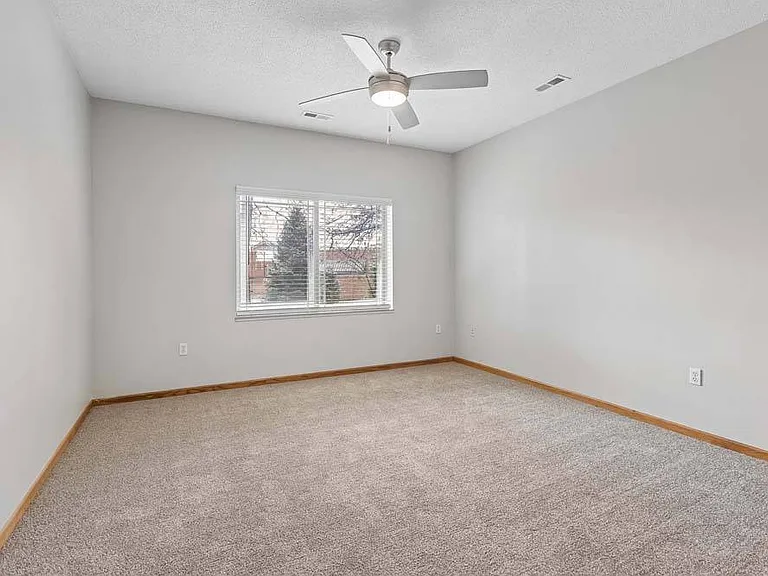 A calm, spacious bedroom ready to be styled into your own peaceful escape.