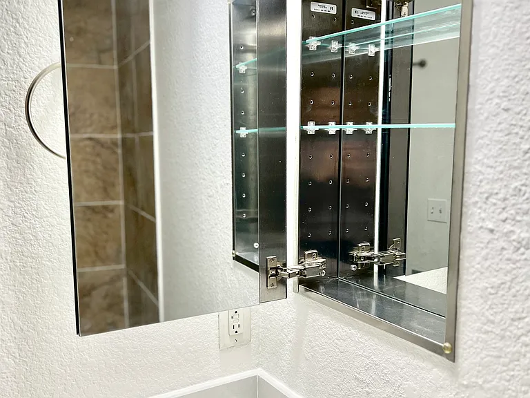 Bathroom vanity and updated stainless steel hardware.