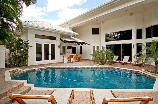 Tropical Courtyard with deep blue salt water pool