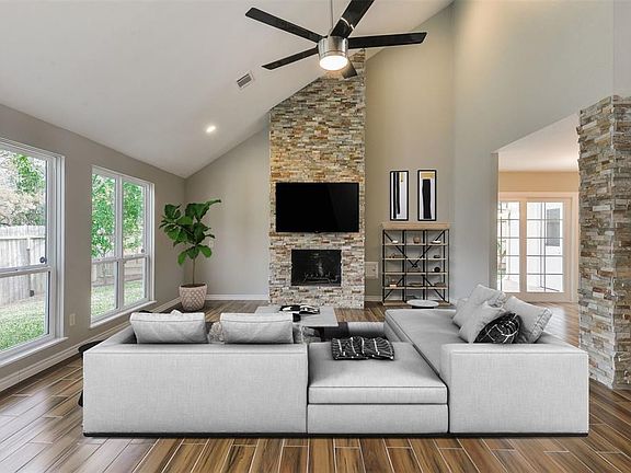 Another view of the gorgeous great room with vaulted ceiling and a seamless flow to the dining and entry.