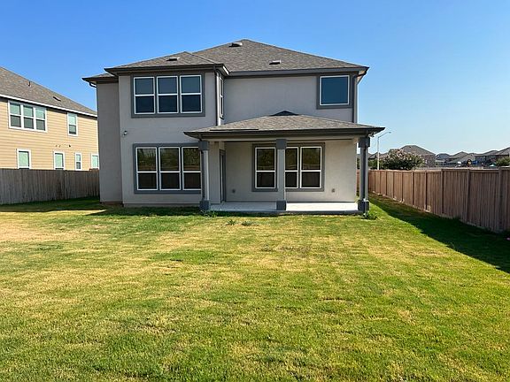 The backyard of the house with large space for play.