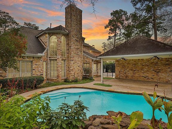The beautifully landscaped back yard offers a pool and covered patio with ceiling fans to help beat the heat.