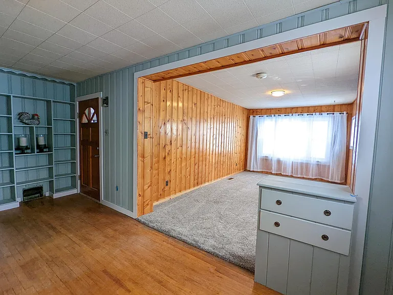Built ins and wood accents add to the charm of this mid-century bungalow!