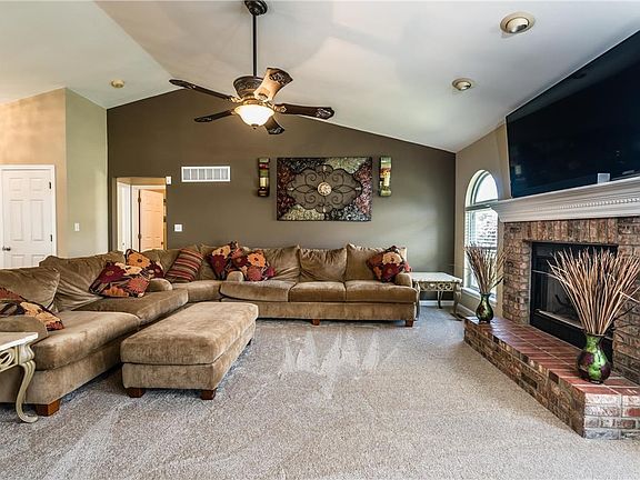 Large family room with vaulted ceiling and fireplace