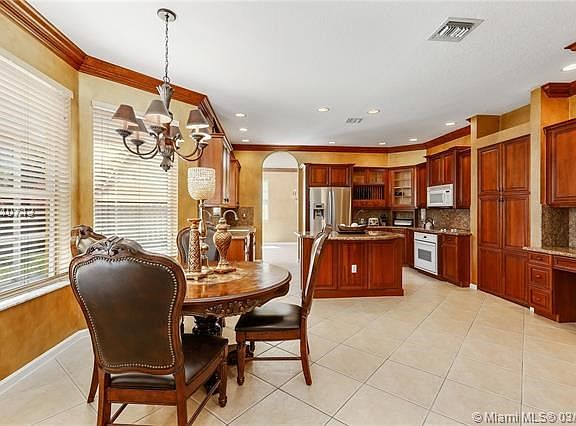 Beautiful functional kitchen w/double door walk in pantry on right & breakfast area