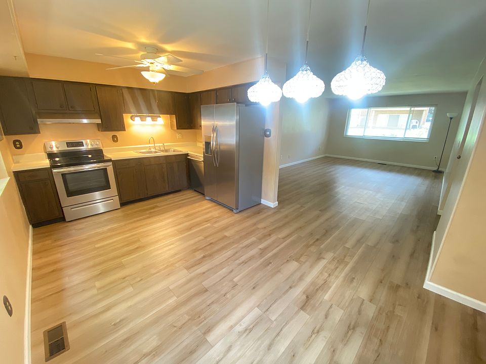 Open Concept. Stainless Steel range, vent, dishwasher, sink, and fridge