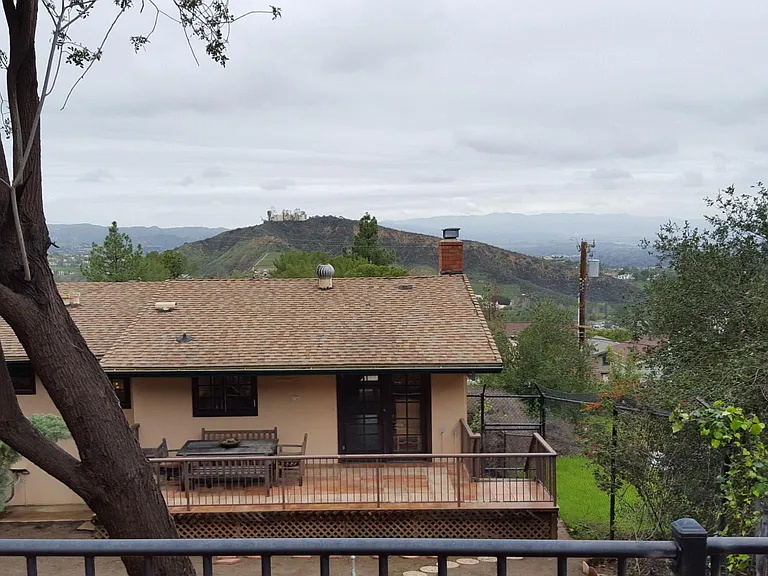 view from top deck in back yard, looking back toward house