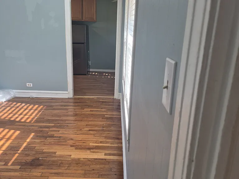 Living room into kitchen/dining area.