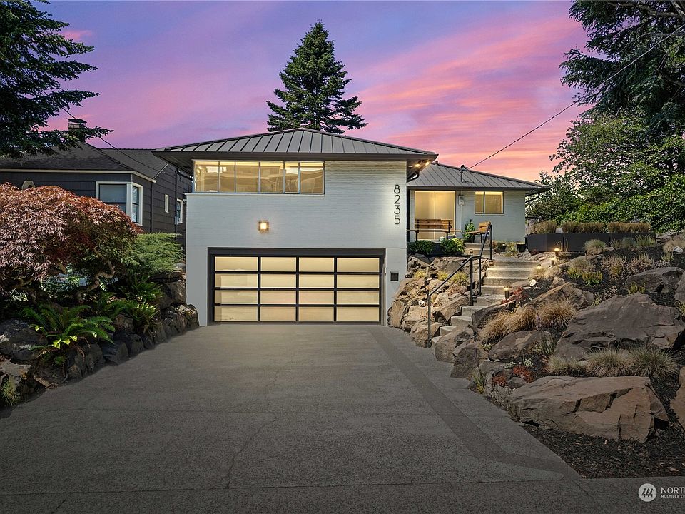 Front of home with modern garage>