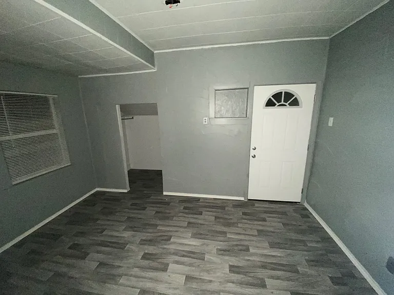 Nice size window lets in good light from front of home. Open concept closet and inlaid shelf next to door. Ceiling fan has been installed in this room.