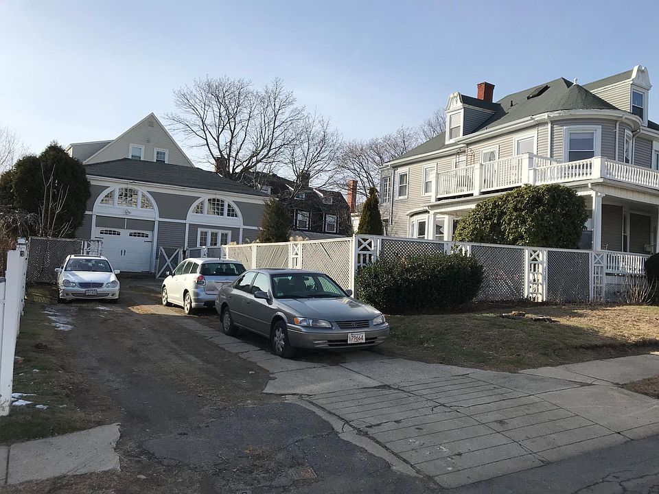 off street parking, fence and carriage house.