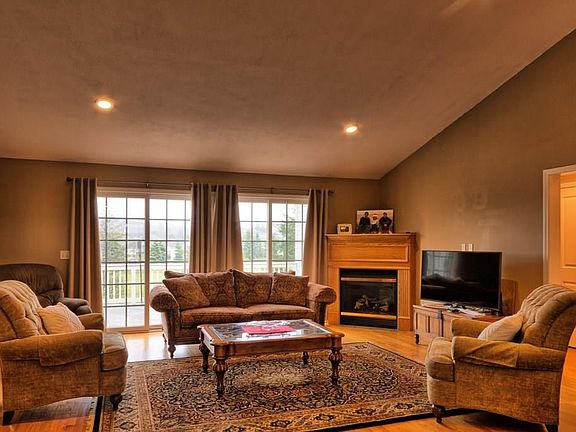 Living space on ground floor with sliders to patio overlooking the golf course