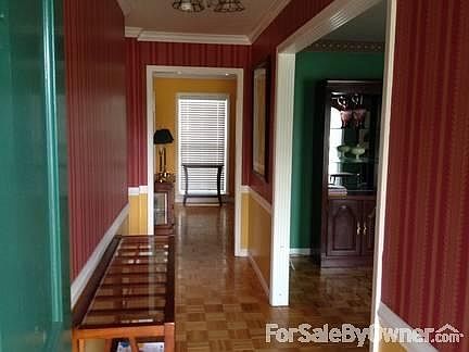 Foyer
						:
						Features oak parquet floors, white base, chair & crown moldings and a chadelier.
