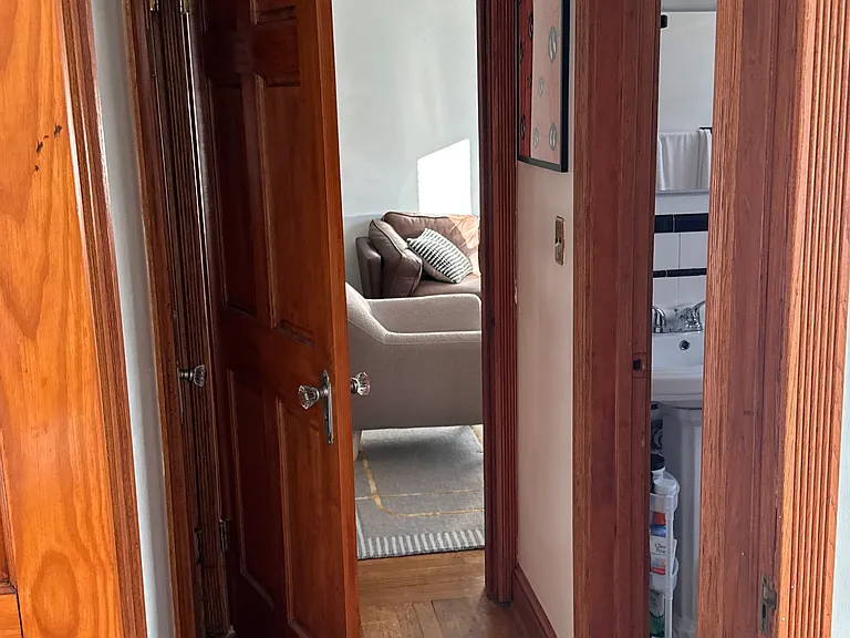 view from bedroom (bathroom right, closet left, living room straight across)
