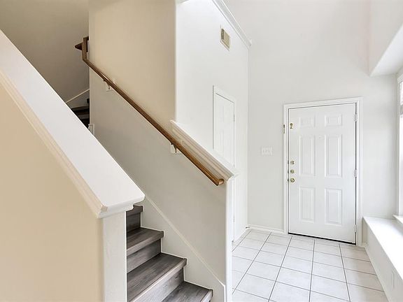 Huge picture window on the ground floor and two windows above provide desired cheerful natural light.