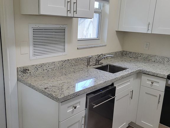 new granite counter tops and new stainless steel dishwasher. Deep undermount sink