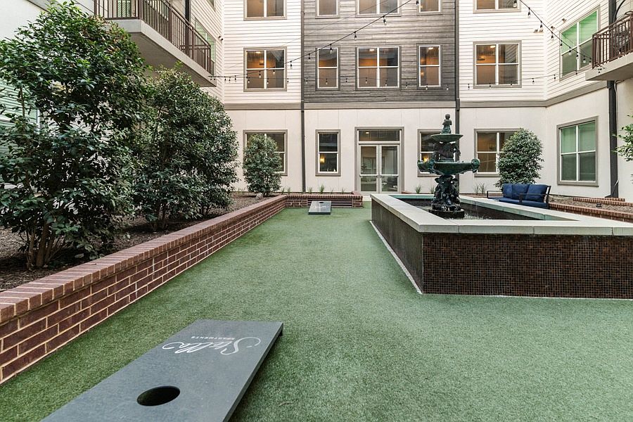 Main courtyard features a boutique, infinity-edge swimming pool and outdoor fire place