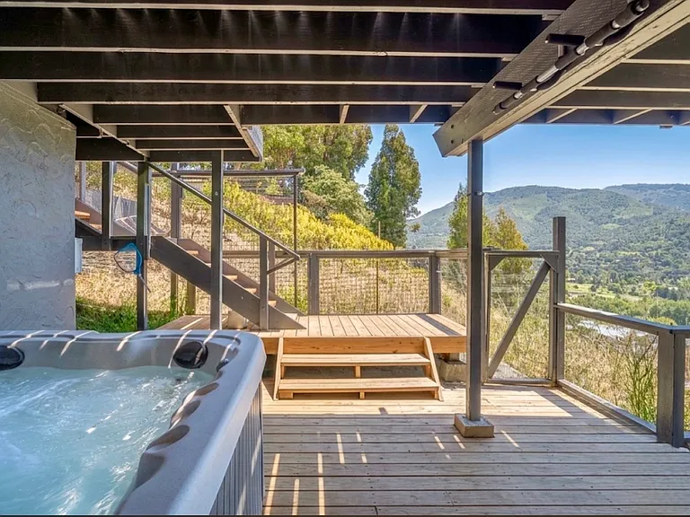 Hot tub located on the lower level. Relax while taking in the sensational view!