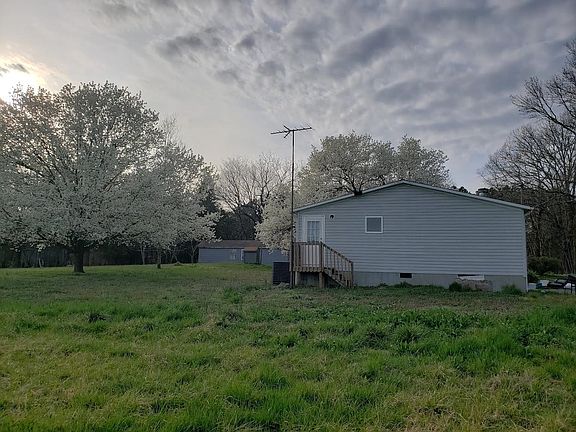 View of side of house and back door facing away from Mouse Creek Road.